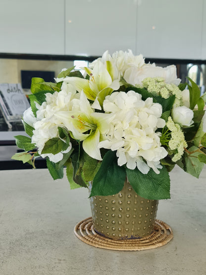 artificial white hydrangeas and lilies, coffee table floral arrangement in olive green ceramic vase french country