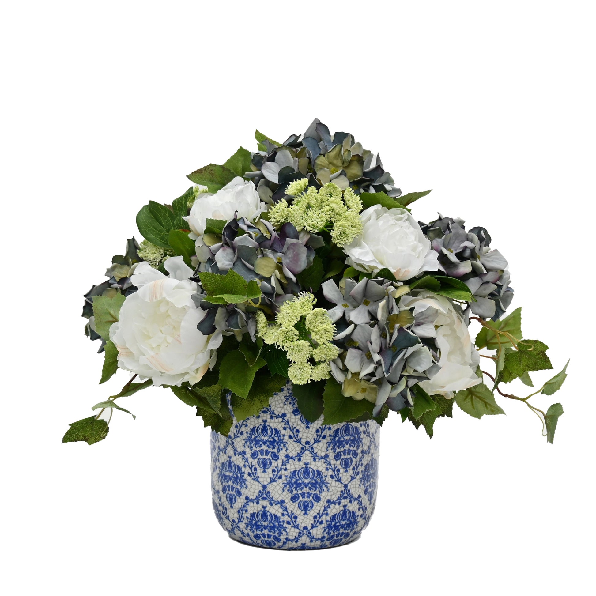 white artificial flowers peony and artificial blue hydrangea in blue and white aged ceramic vase