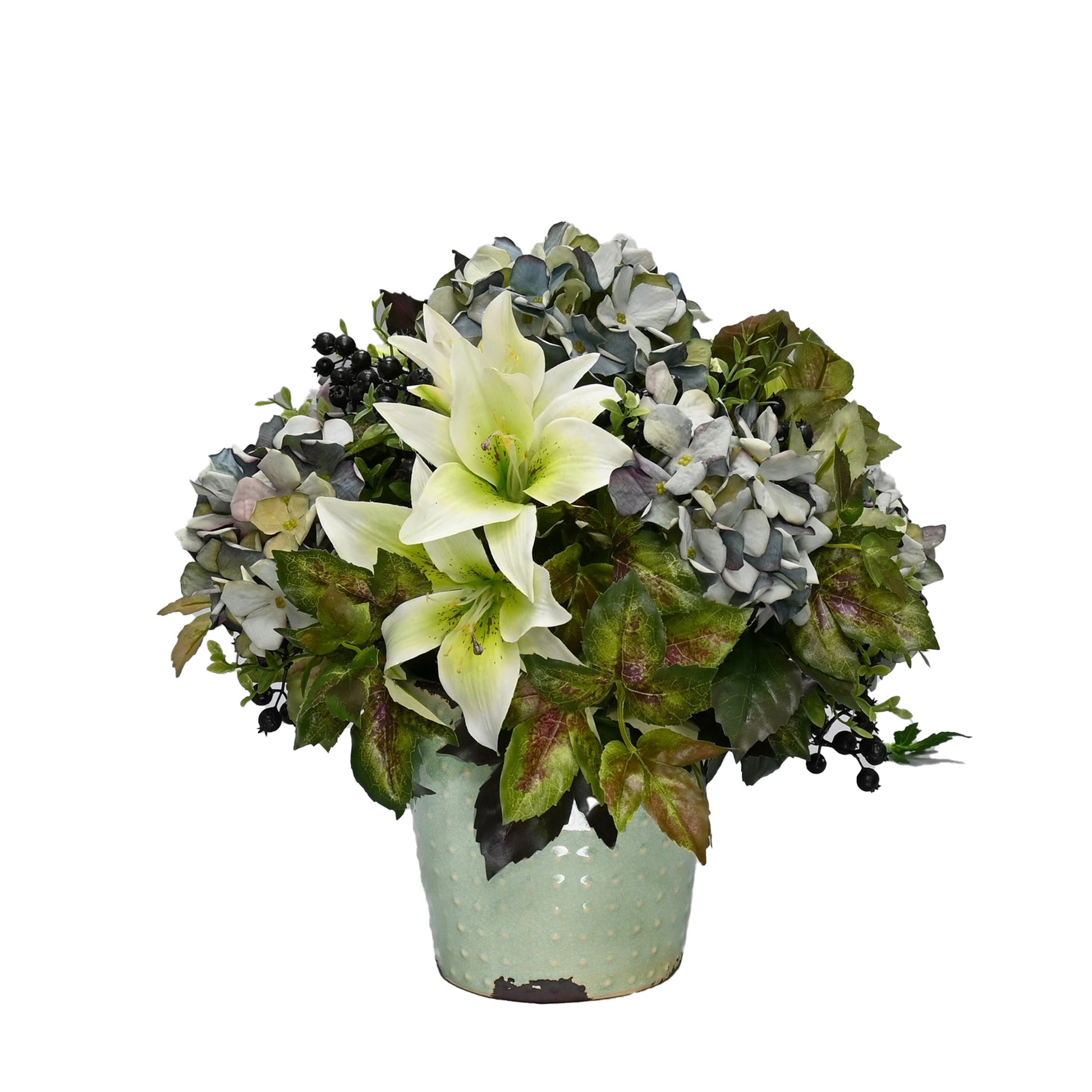 artficial flower arrangement with blue hydrangeas berries and lilies in duckegg ceramic vase