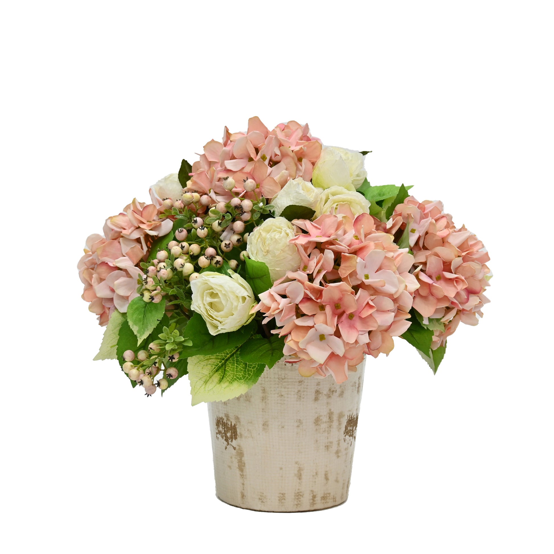 artificial pink hydrangeas white roses and pink berries floral arrangement set into aged cream ceramic vase