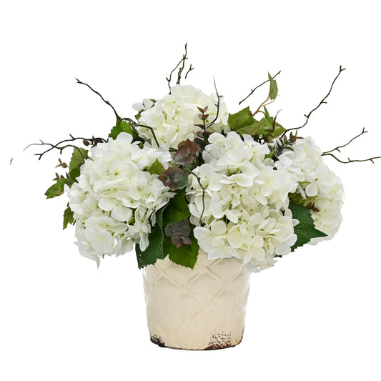 artificial white hydrangeas eucalyptus foliage in aged cream vase